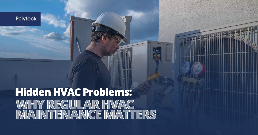 Polyteck engineer wearing a hard hat and safety glasses inspecting rooftop HVAC equipment, featured in an article about the importance of regular HVAC maintenance.